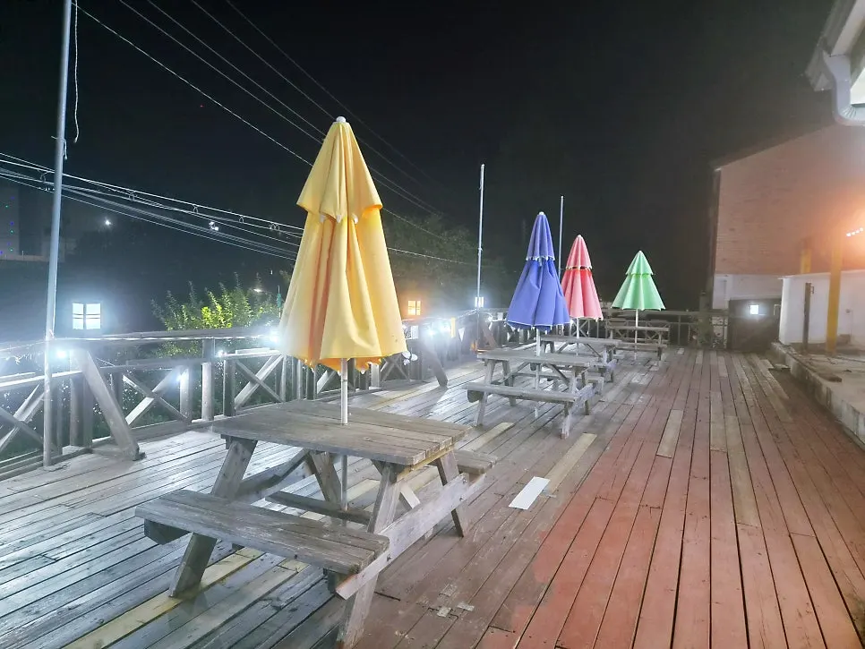 Outdoor parasol seating area at Bomseol
