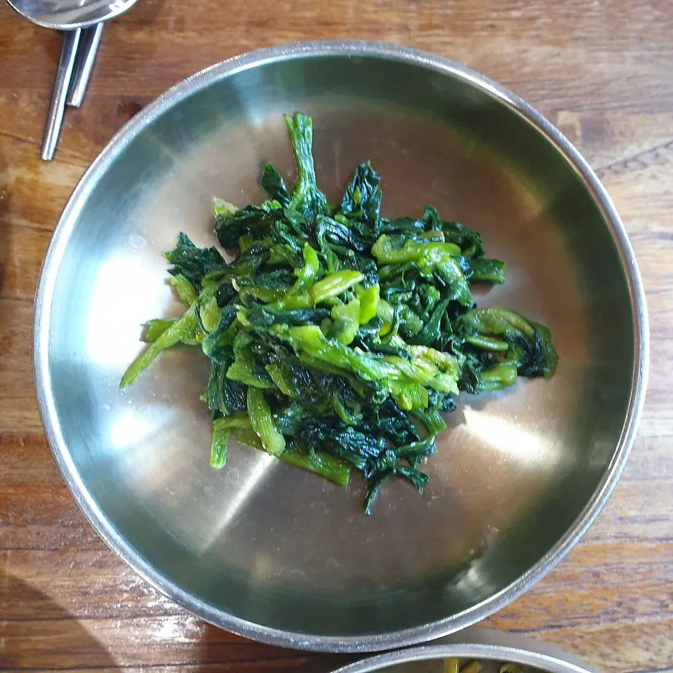Lotus root side dish with black sesame at Bomseol