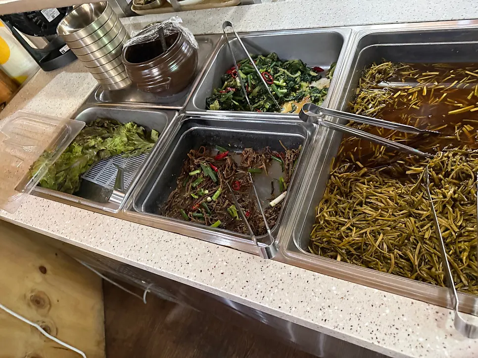 Shiitake sweet-and-sour and namul side dishes at the self-bar