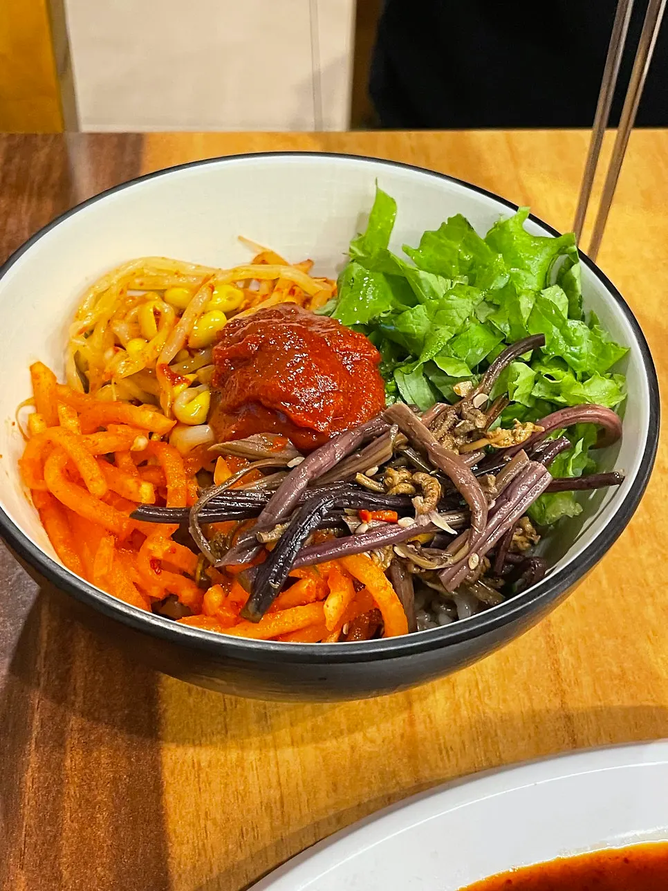 Mixing the yeolmu barley bibimbap