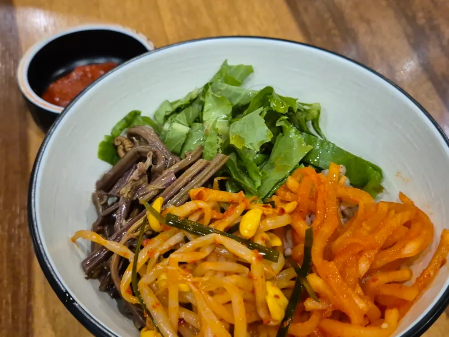 A bowl of barley bibimbap with vegetables