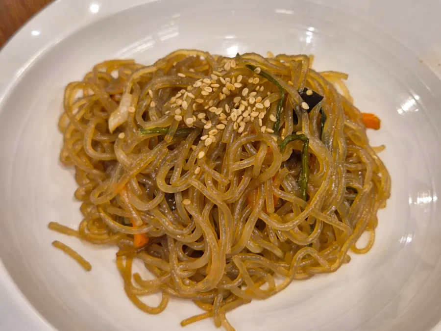 Japchae served as a side dish on the Bomseol table