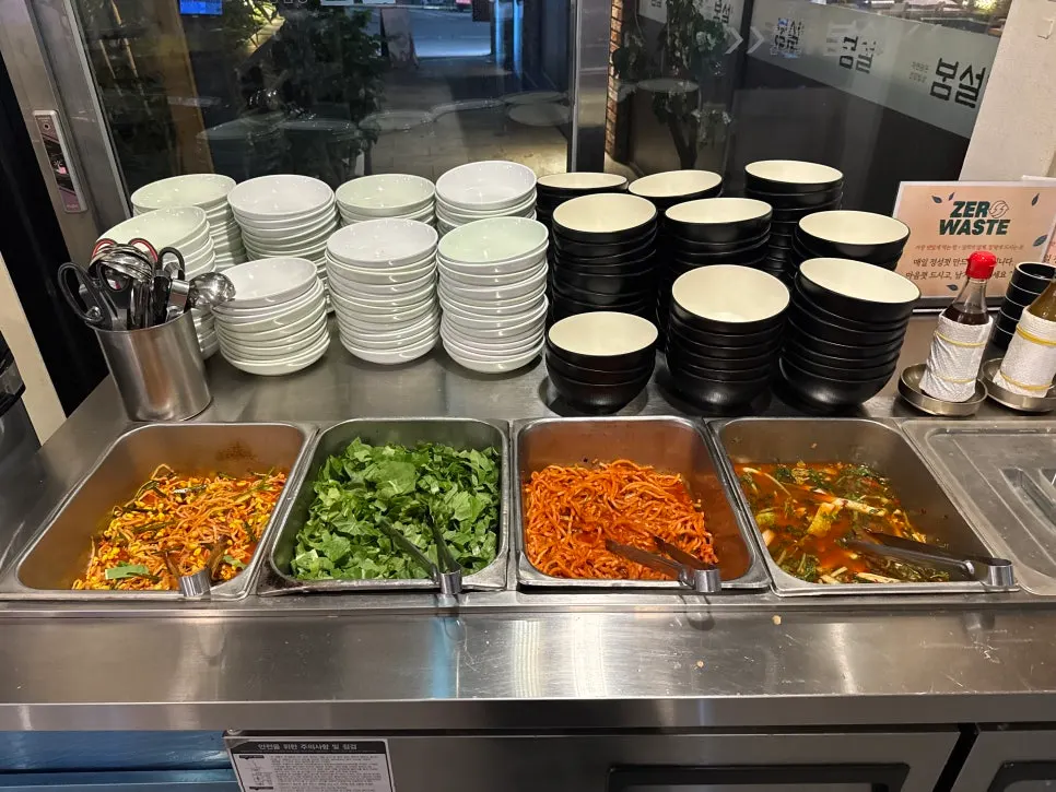 Self-serve bar with barley rice and side dishes at Bomseol Main Branch