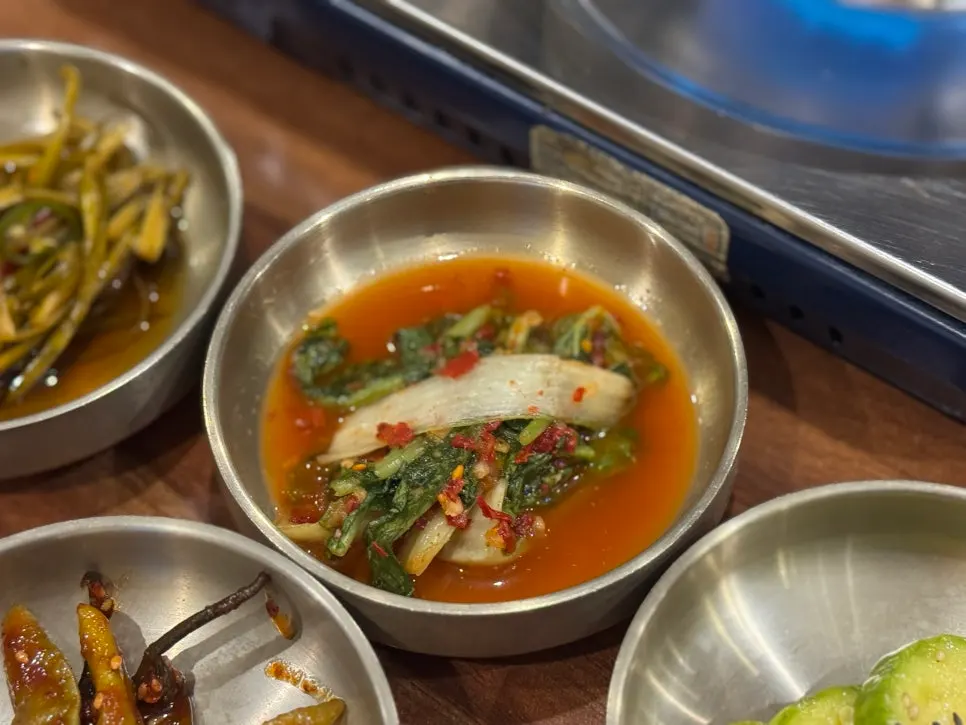Table fully set with side dishes as part of the Bomseol table