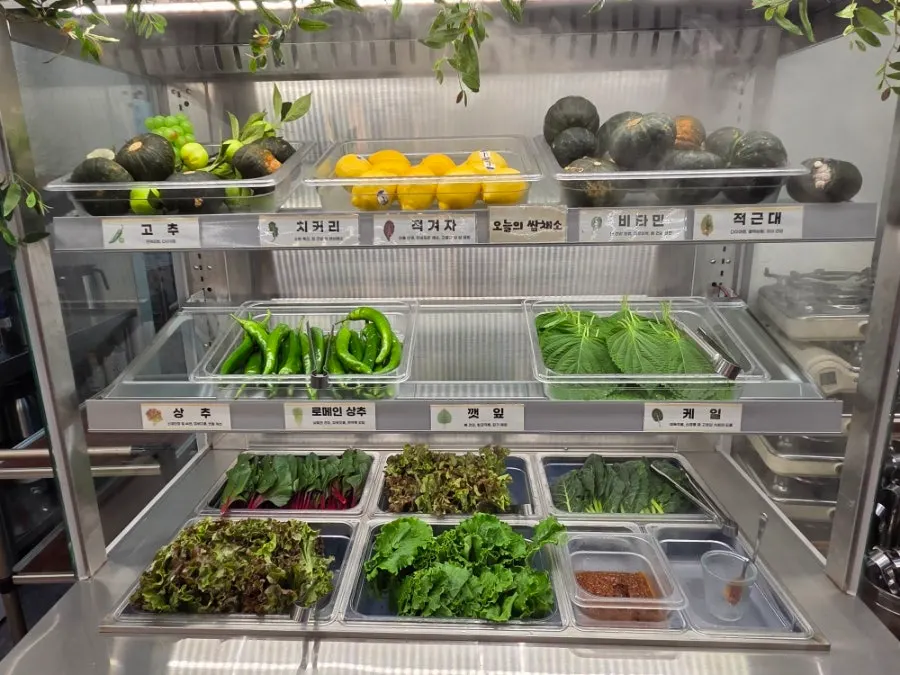 Side dishes and wrap vegetables at Bomseol's self-serve bar
