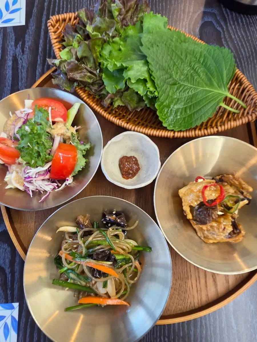 Hanjeongsik side dishes served in brass bowls