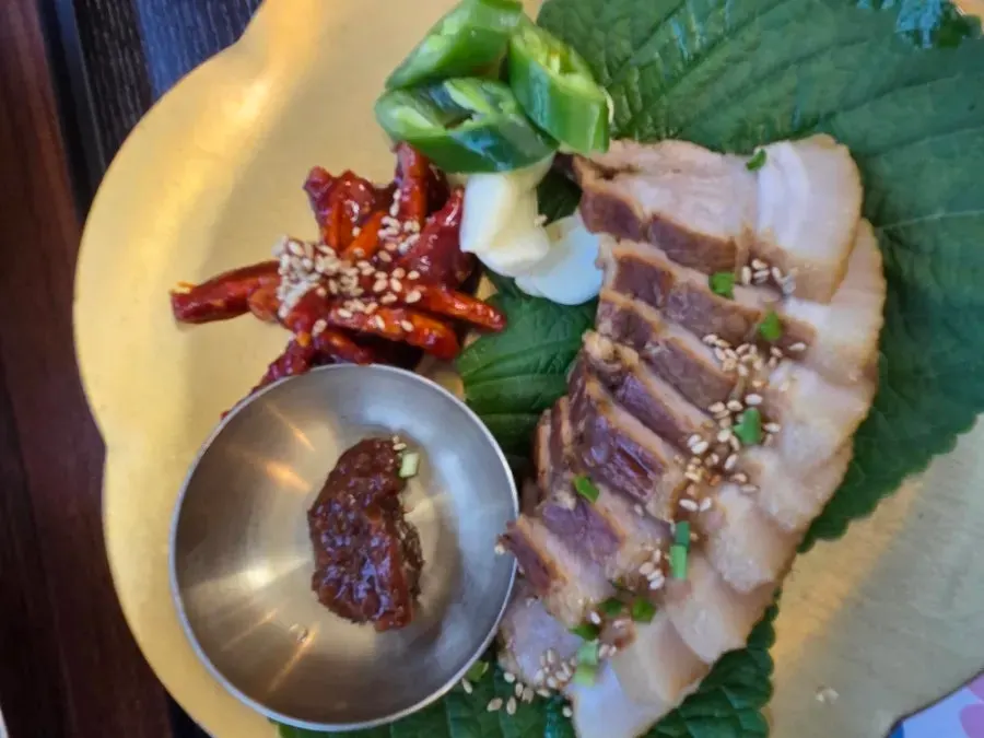 Bossam plate with raw radish salad and garlic