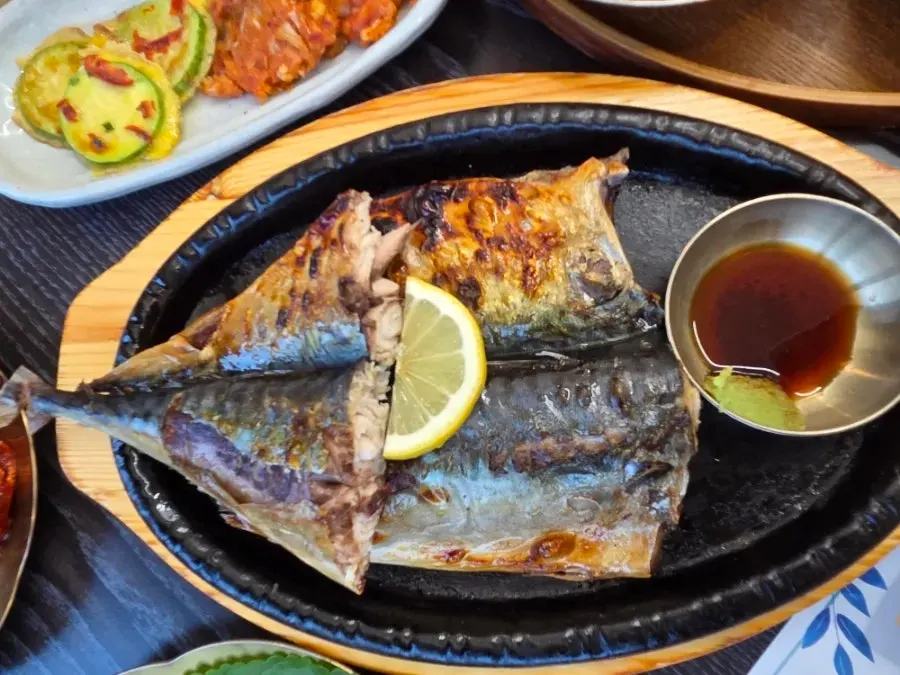 A whole grilled mackerel cooked to golden brown