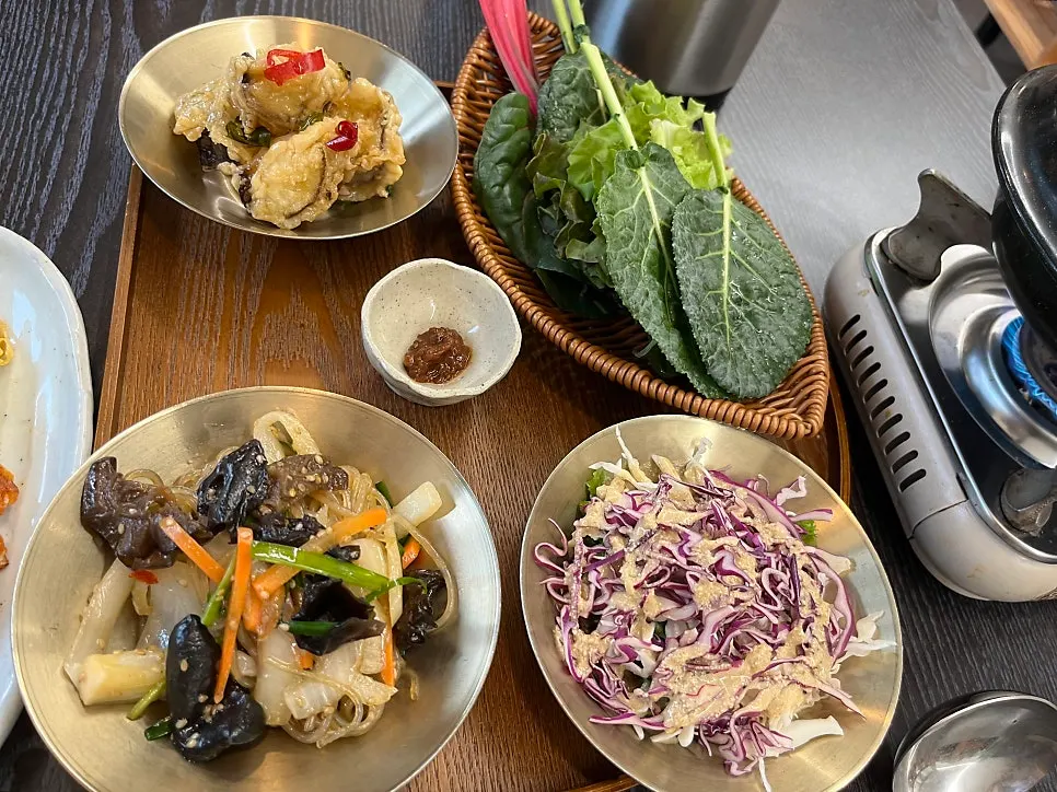 Close-up of lightly seasoned hanjeongsik side dishes