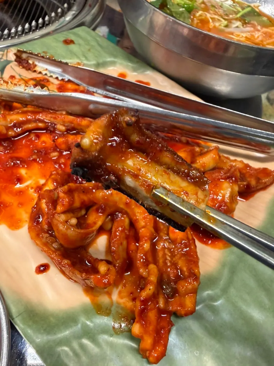 Marinated hagfish over charcoal
