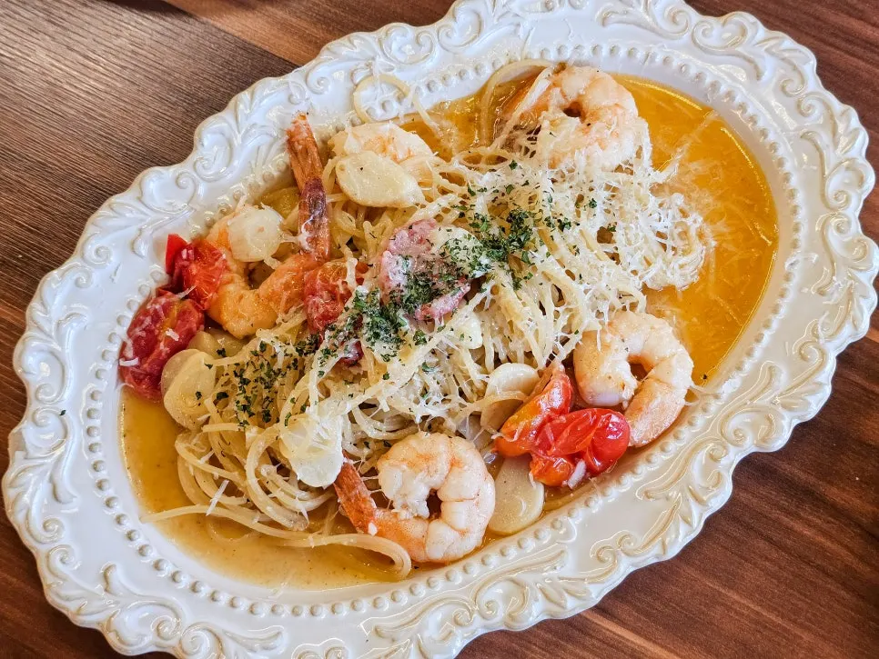 Shrimp aglio e olio pasta topped with large shrimp