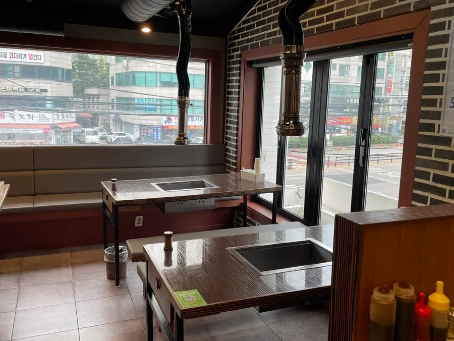 Interior of the restaurant with wide floor-to-ceiling windows