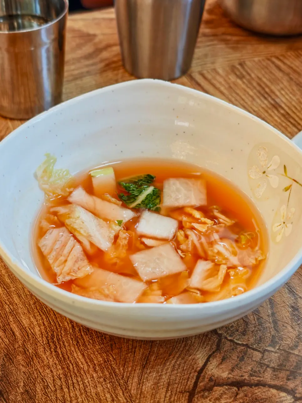 Plate of doenjang peppers and dongchimi radish water kimchi