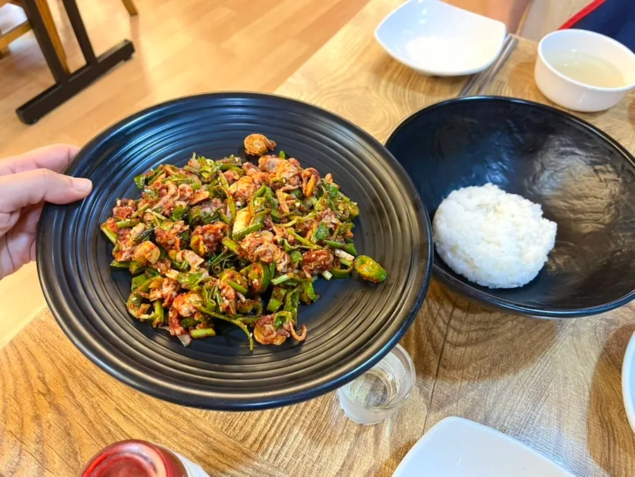 Cockle bibimbap drizzled with sesame oil