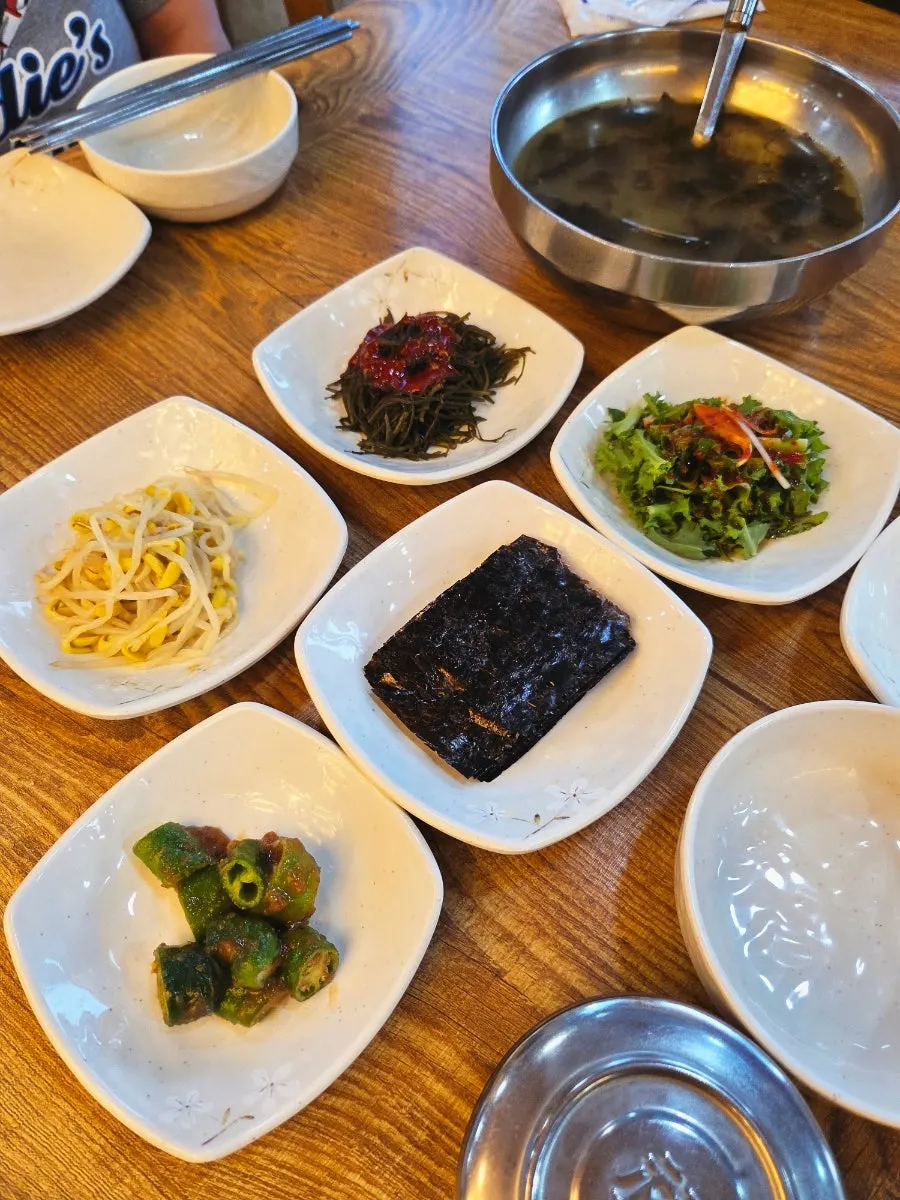 Table setting with fish seaweed soup and basic side dishes