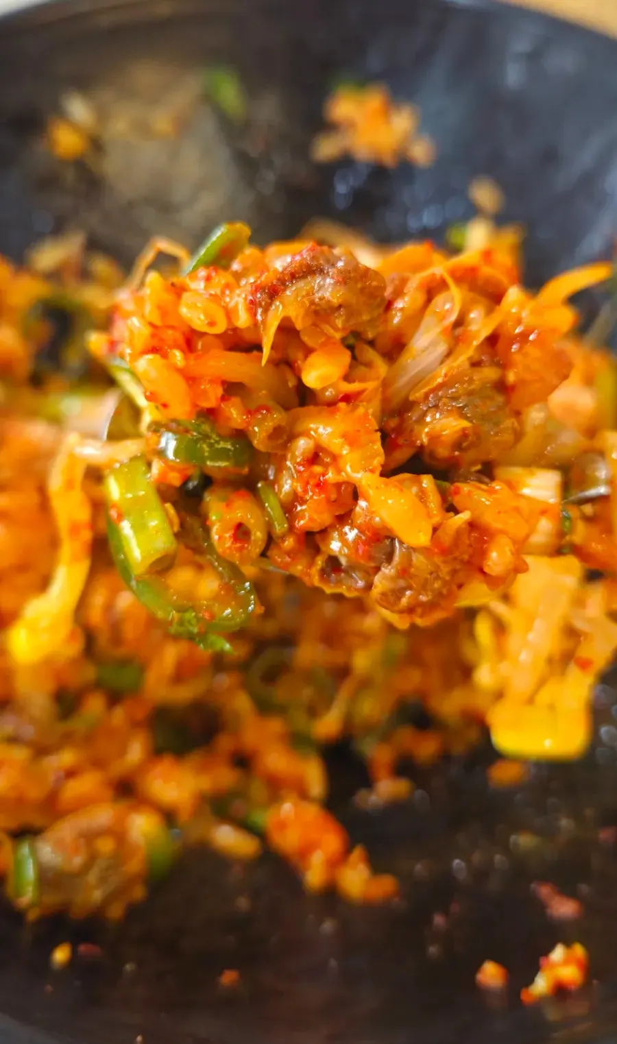 Bibimbap topped generously with seasoned cockles