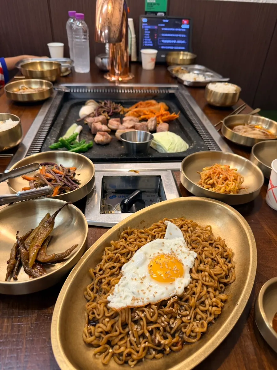 Jjajang ramyeon topped with a fried egg