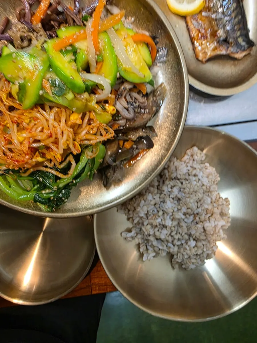A plate piled high with side dishes