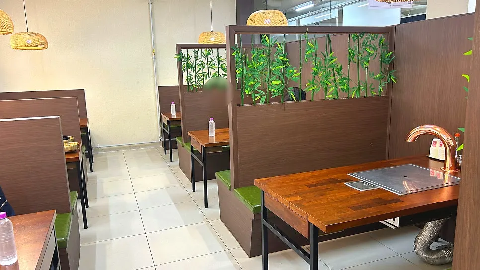 Hwadamga storefront and parking area