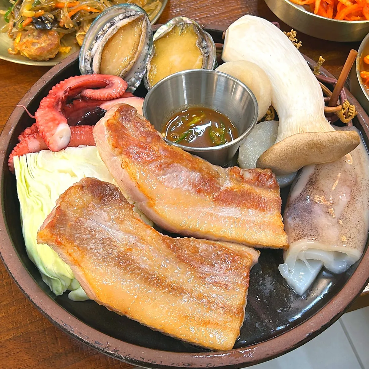 Korean pork belly seafood set with basic side dishes