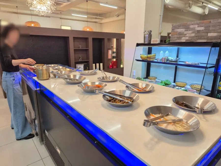 Hwadamga's self-serve bar with over 20 side dishes