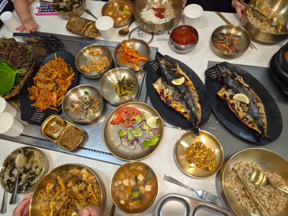 The finished table spread of set menus and self-serve side dishes