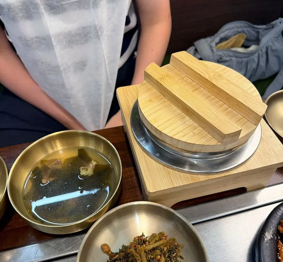 Hwadamga's table loaded with side dishes