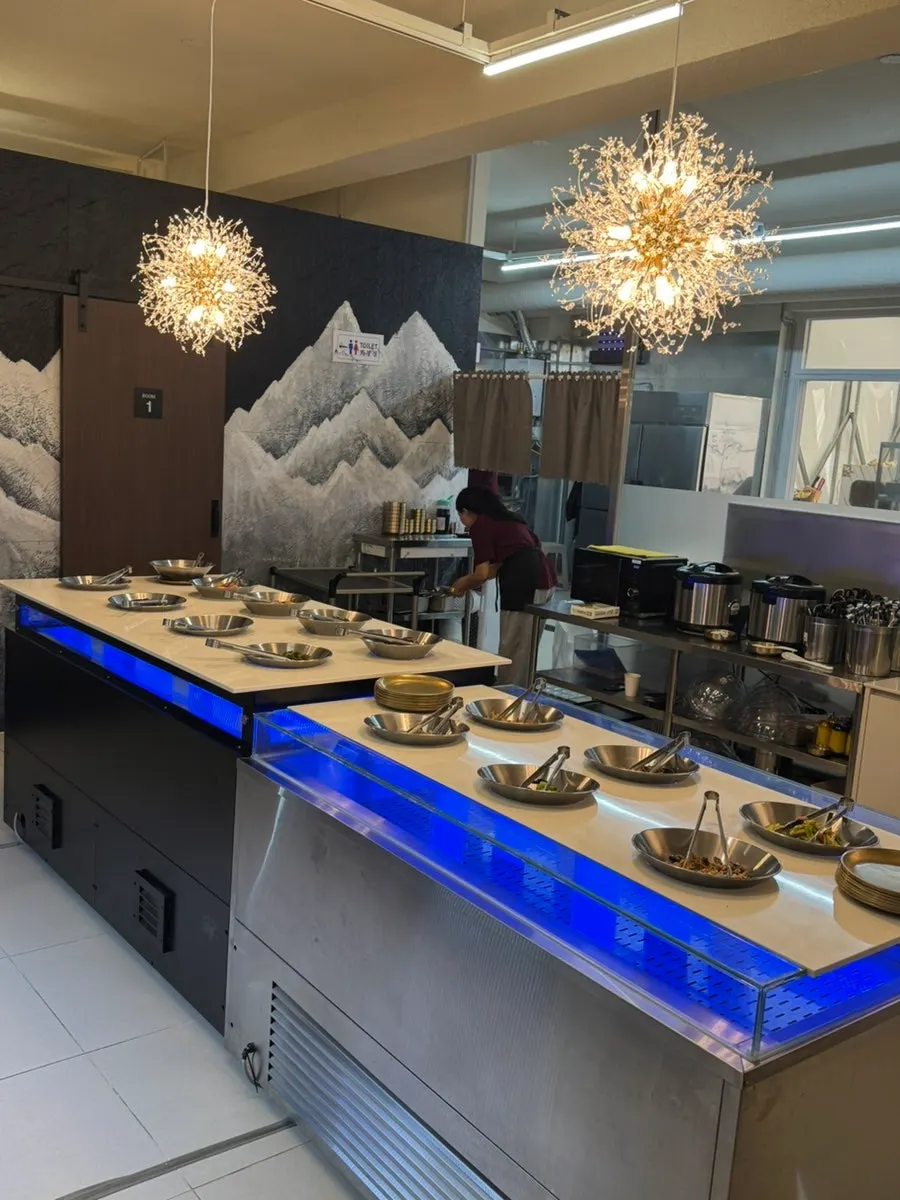 Self-serve side dish corner at Hwadamga