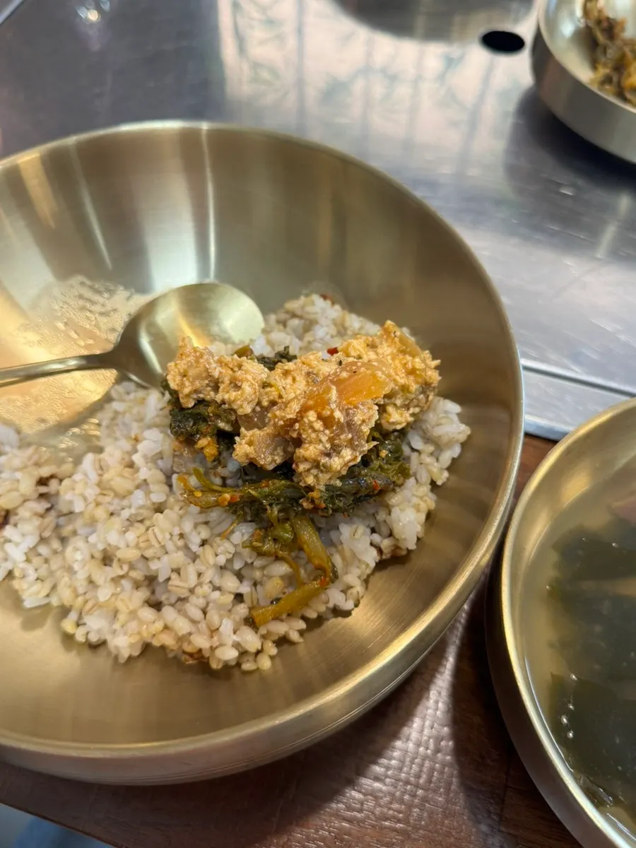 Barley rice bibimbap drizzled with sesame oil