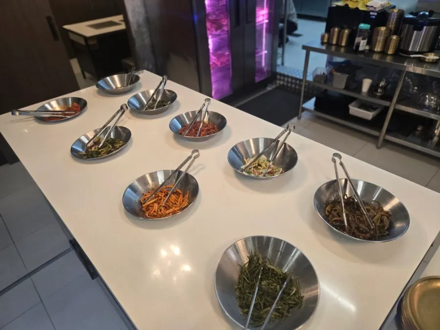 Hwadamga side dishes served in pretty tableware