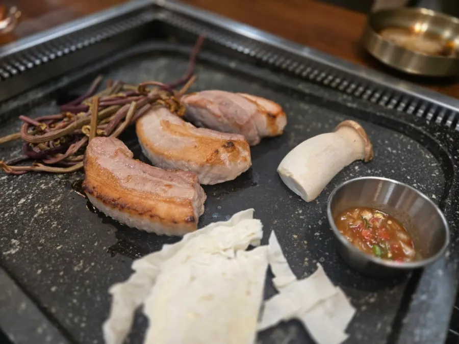 Thick-cut par-grilled Korean pork belly at Hwadamga