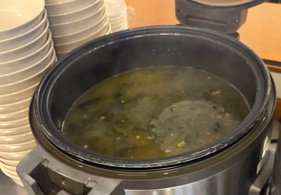 Self-serve bar with seaweed soup and banchan