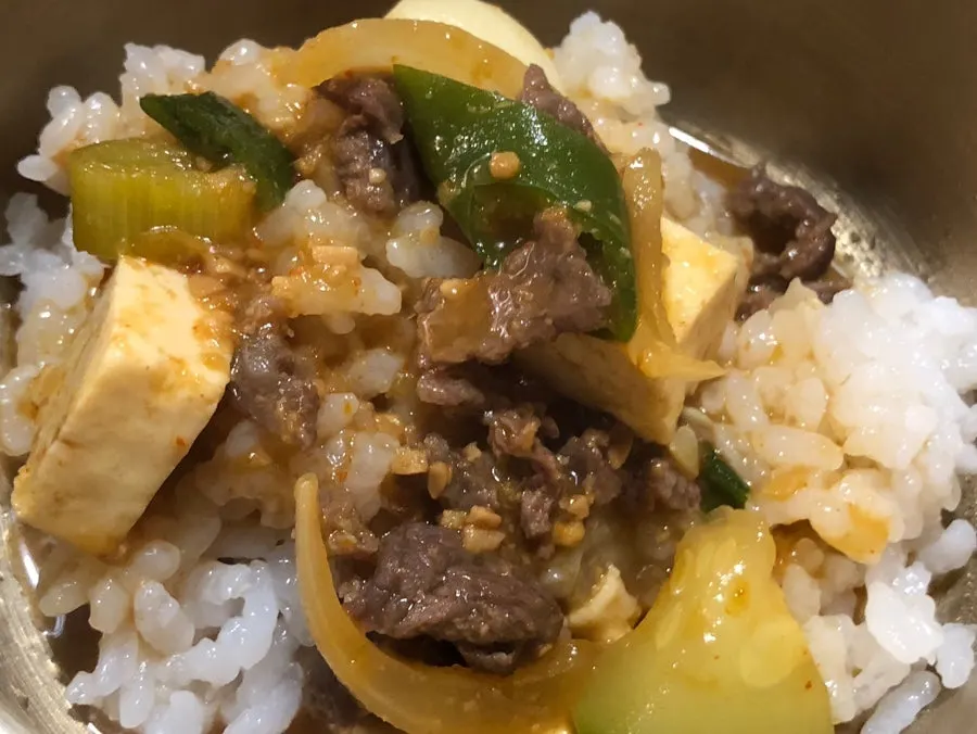 Bowl of rice served alongside doenjang jjigae