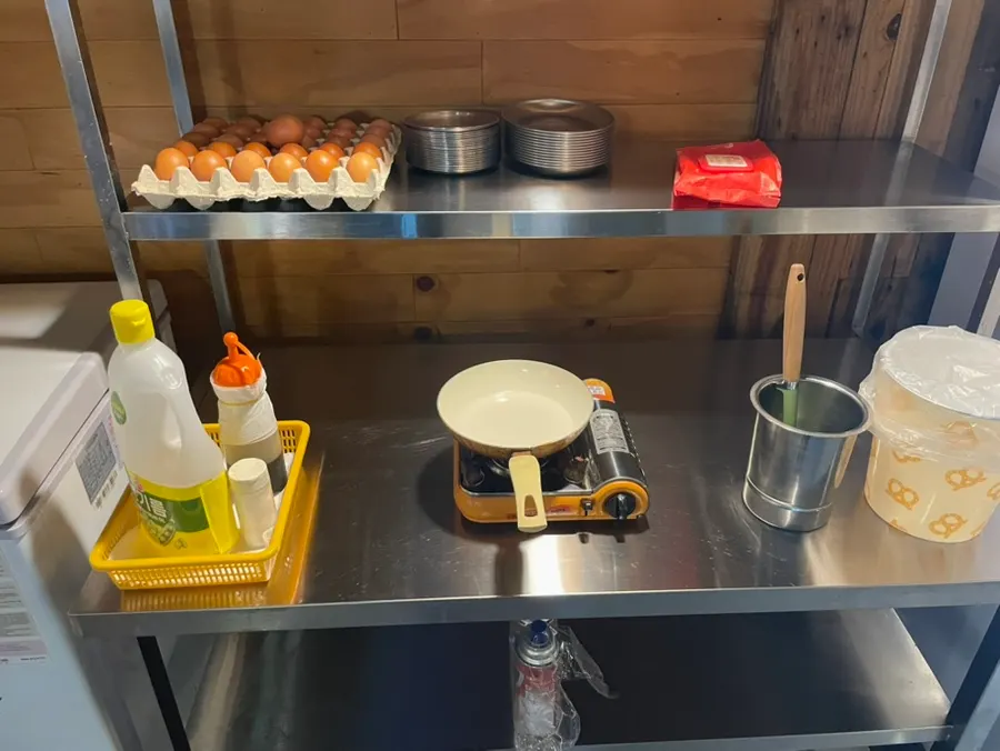 A fried egg cooked by hand