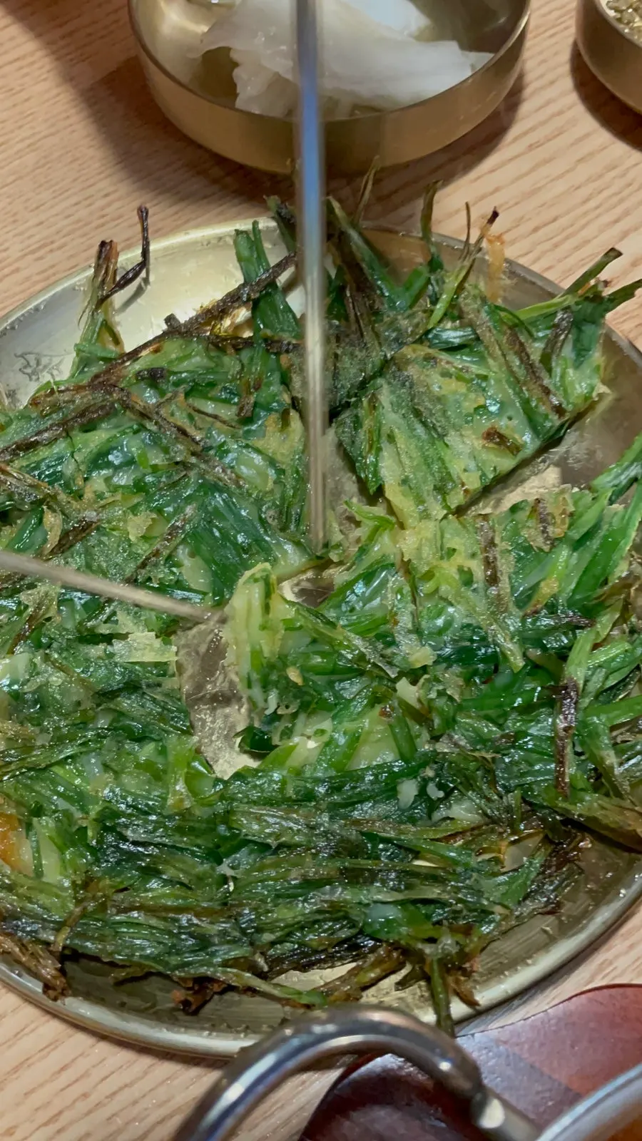 Picking up a piece of pajeon