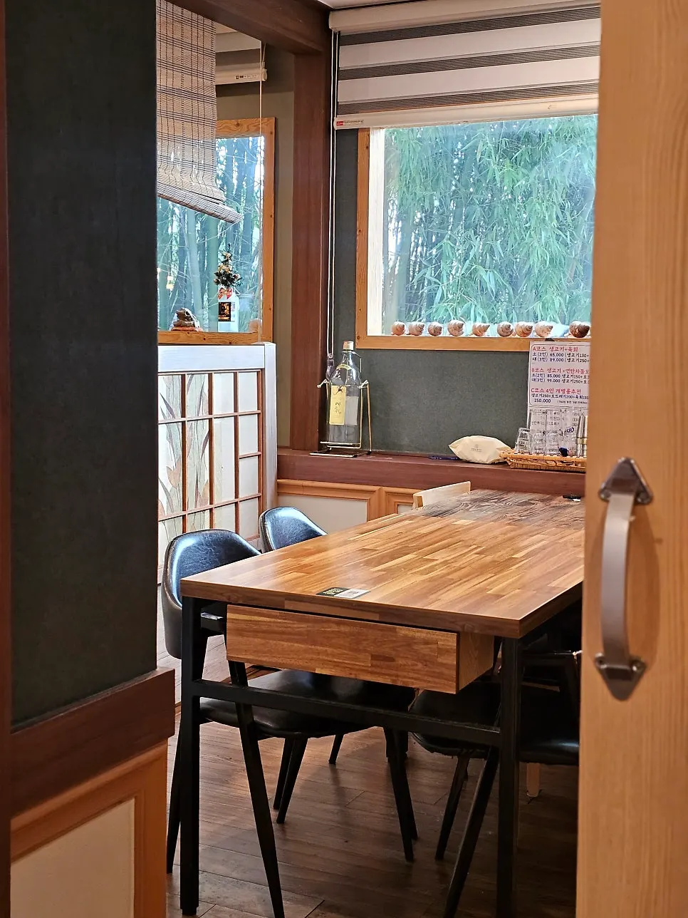Seating inside the room with a bamboo forest view