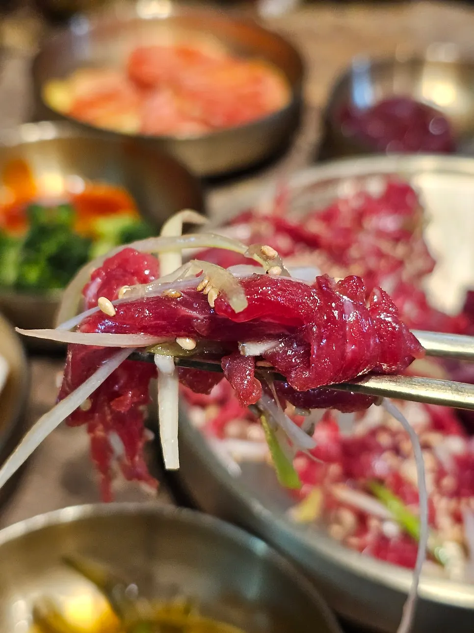 Yukhoe topped with scallion shreds