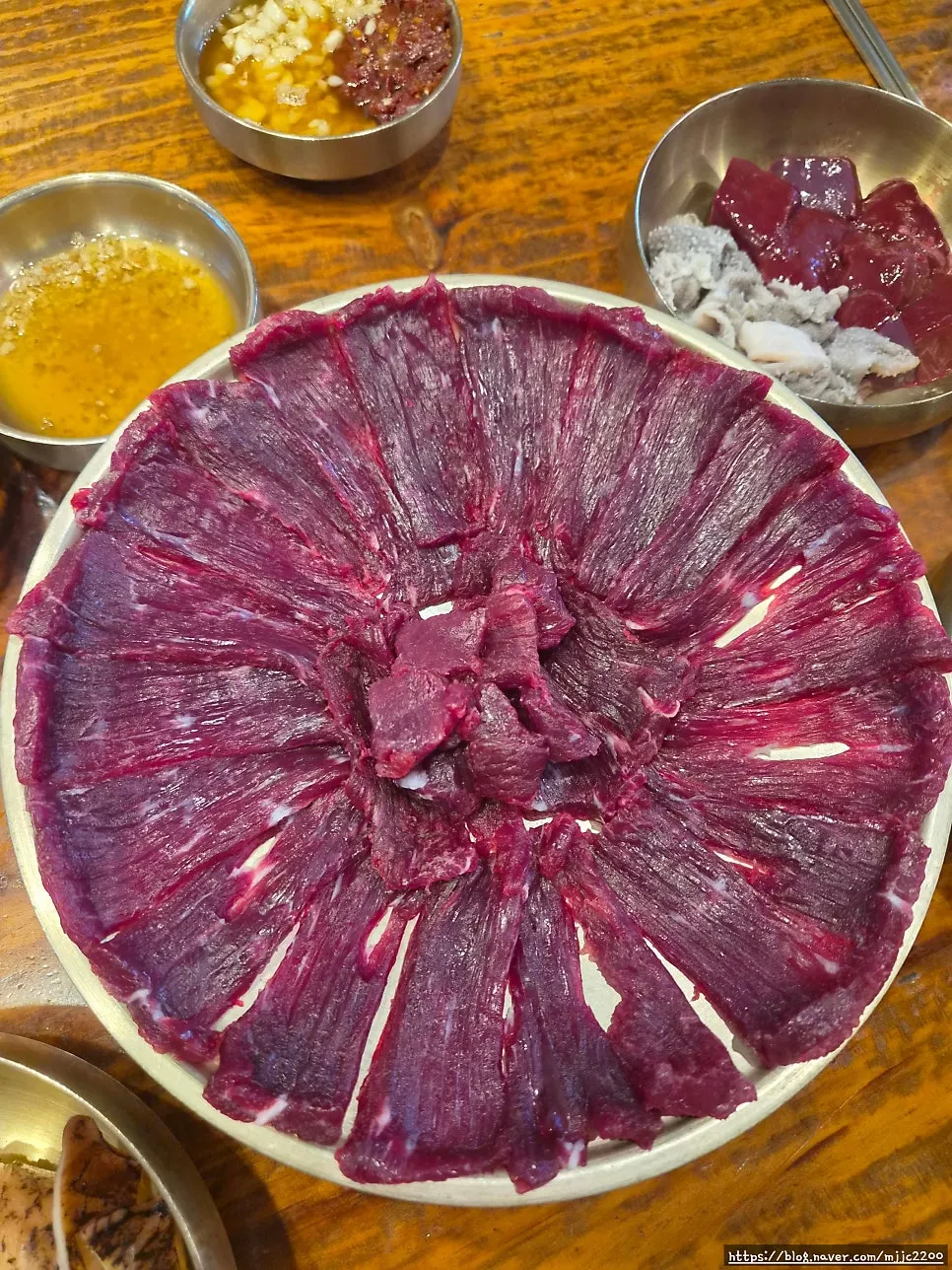 Generously piled raw beef big plate