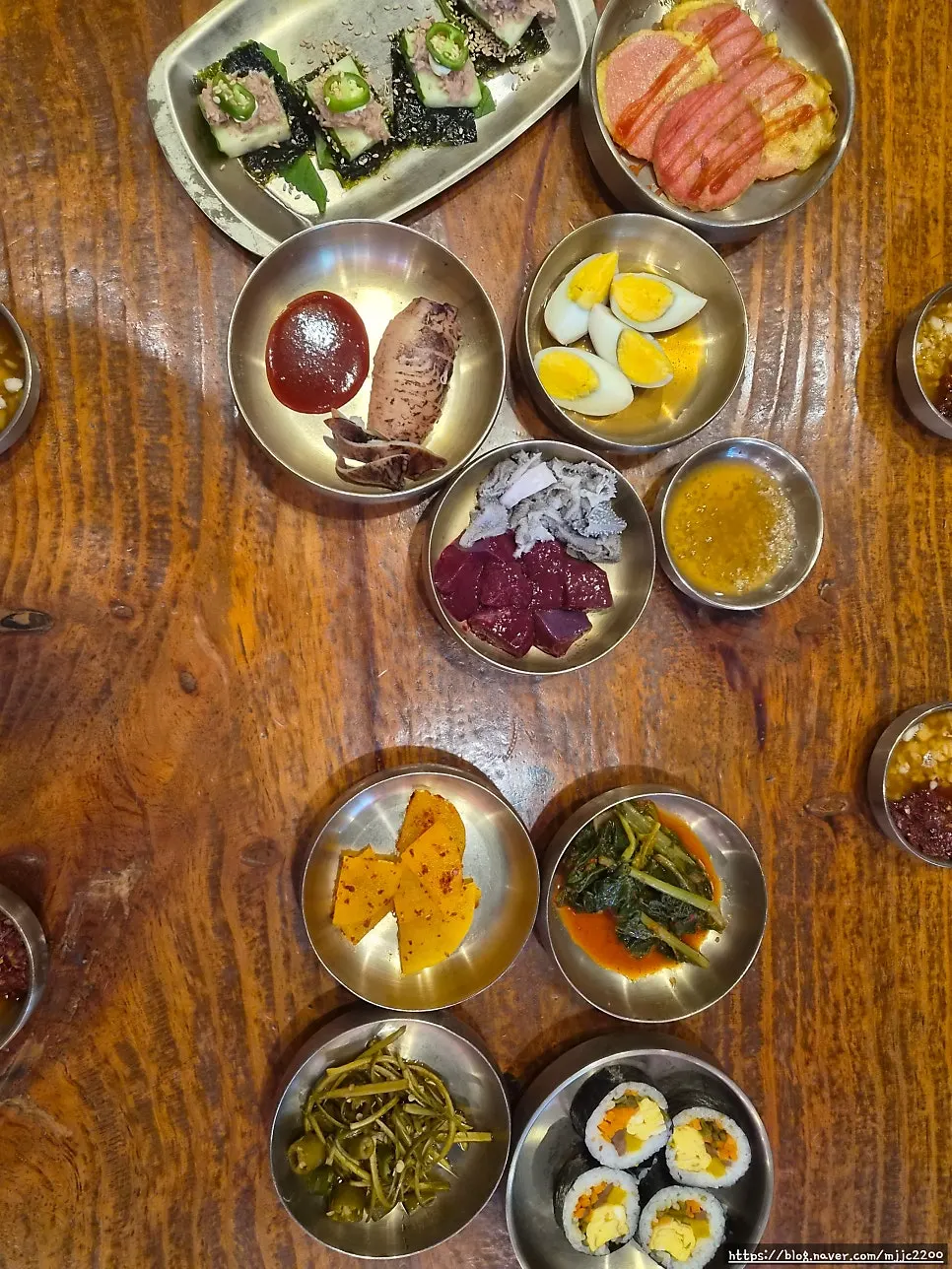 Hearty sigeumchi soup and a table full of side dishes