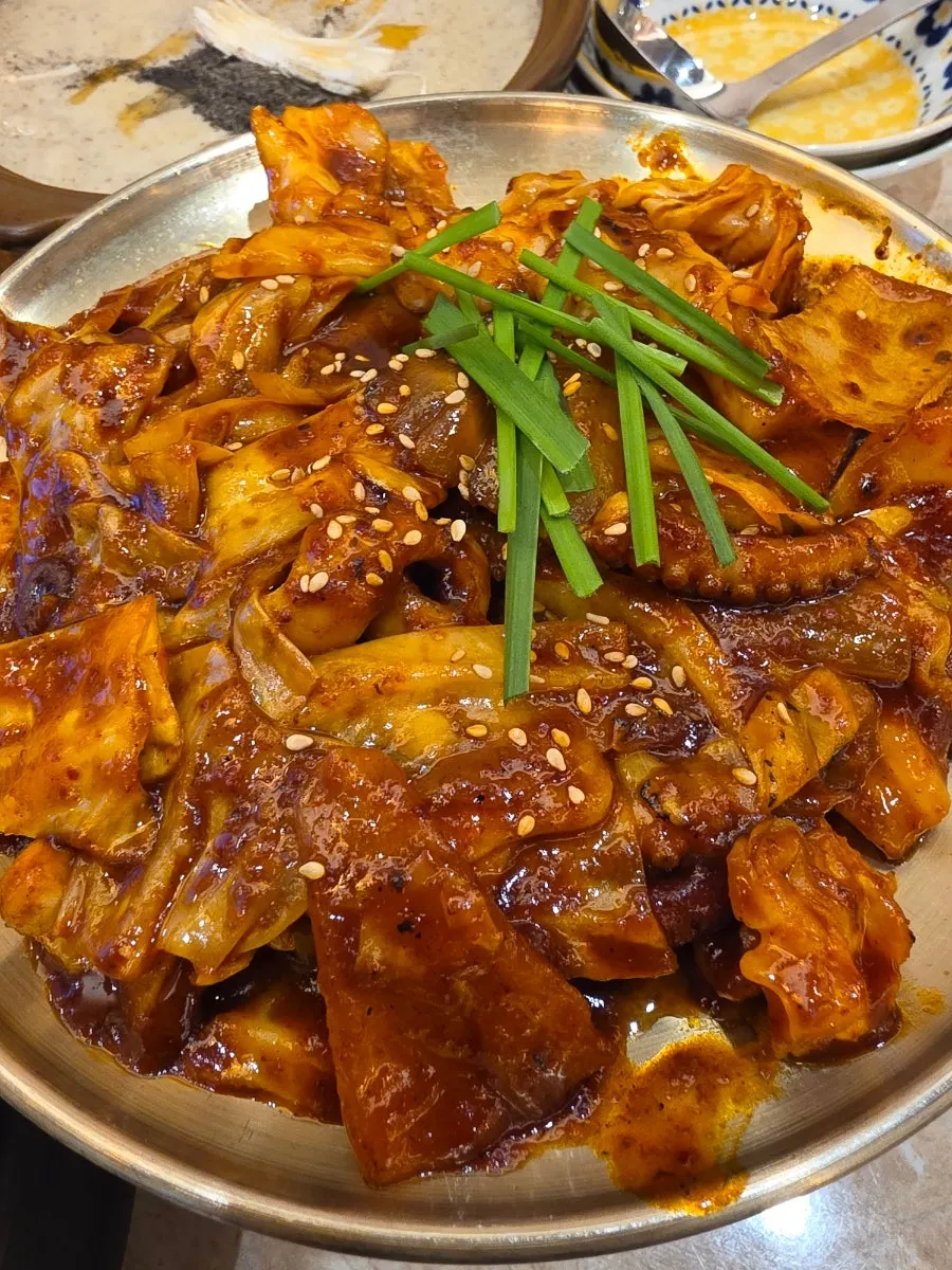 Close-up of octopus stir-fried in sauce over rice