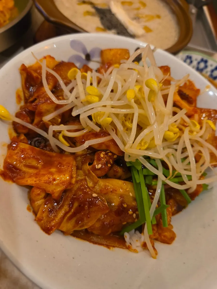 Nakji deopbap served with side dishes