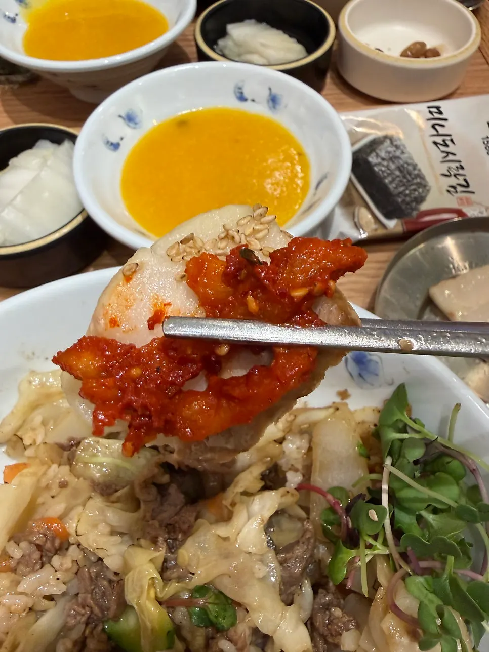 Side dishes and soup set out together with the meal