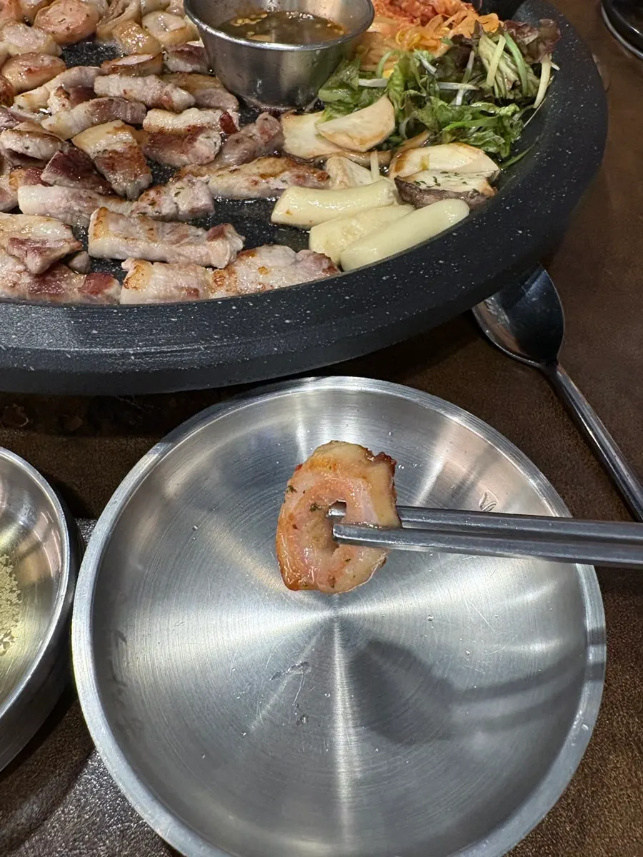 Raw makchang dipped in makjang sauce at Bongja Makchang