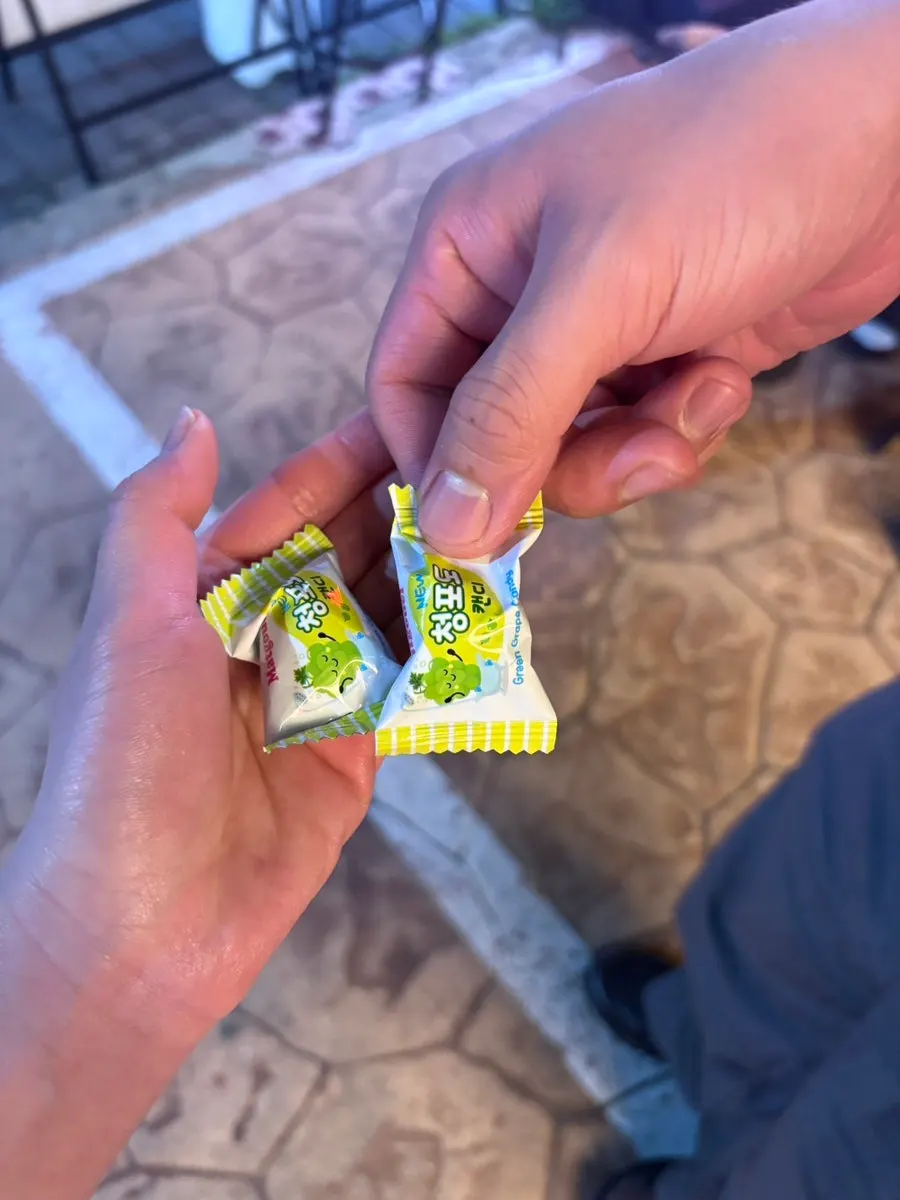 Green grape candy received after paying