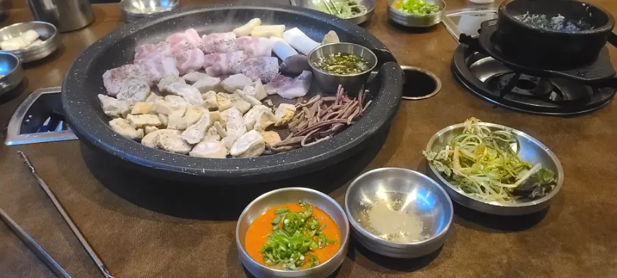 Bongja Combo platter with raw makchang and raw pork belly