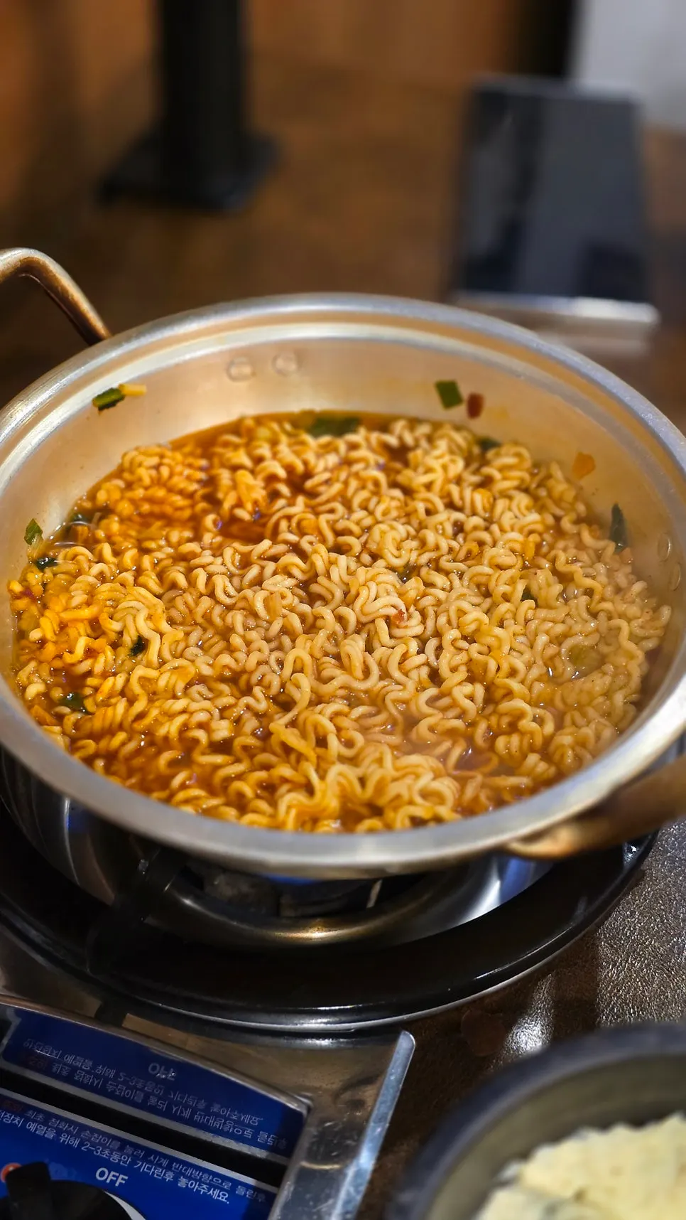 Ramyeon cooked in a pot at the self-serve bar