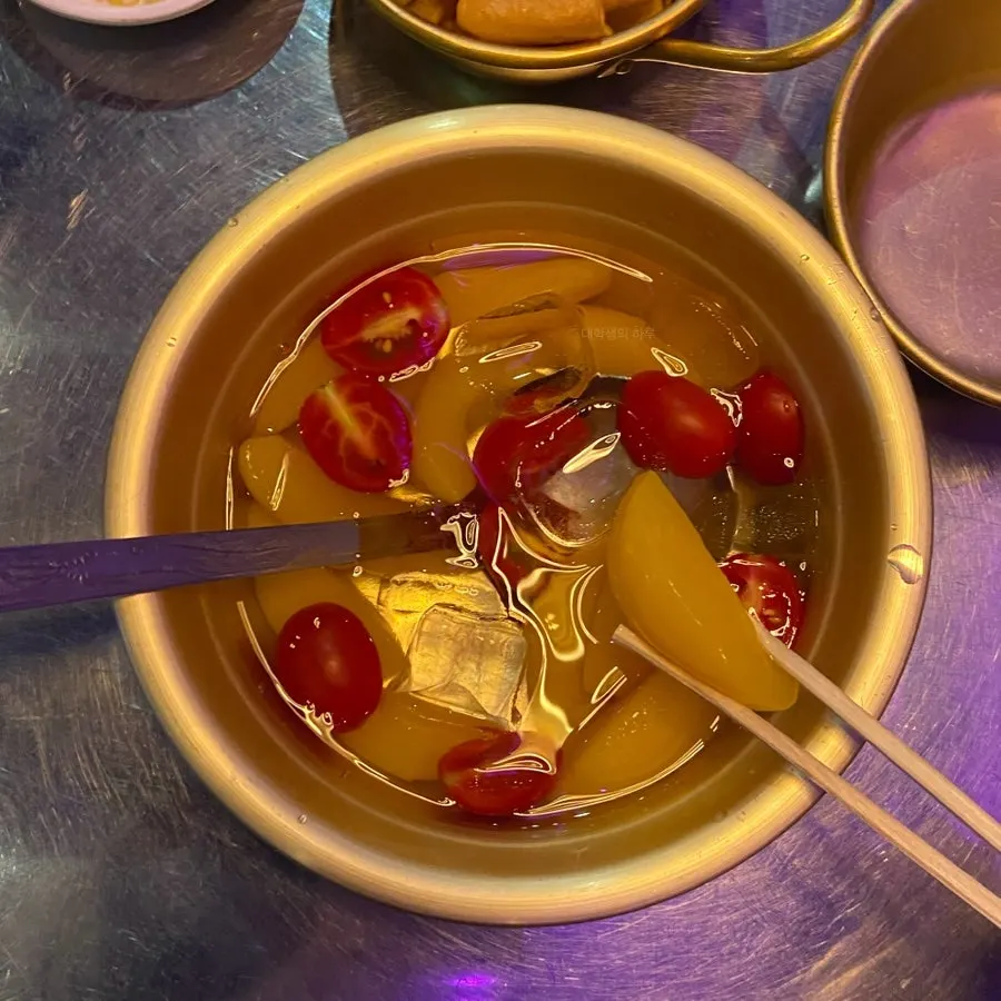 Cold iced yellow peaches served as a snack
