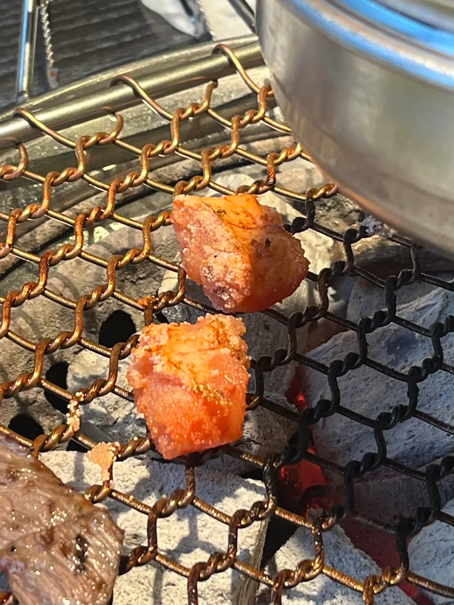 Salted pollock roe grilled alongside hanwoo on the grill