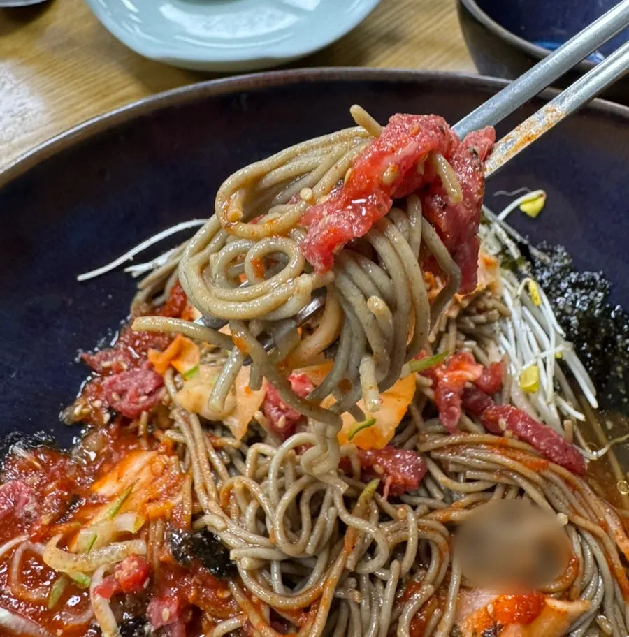 Buckwheat noodles wrapped around raw beef
