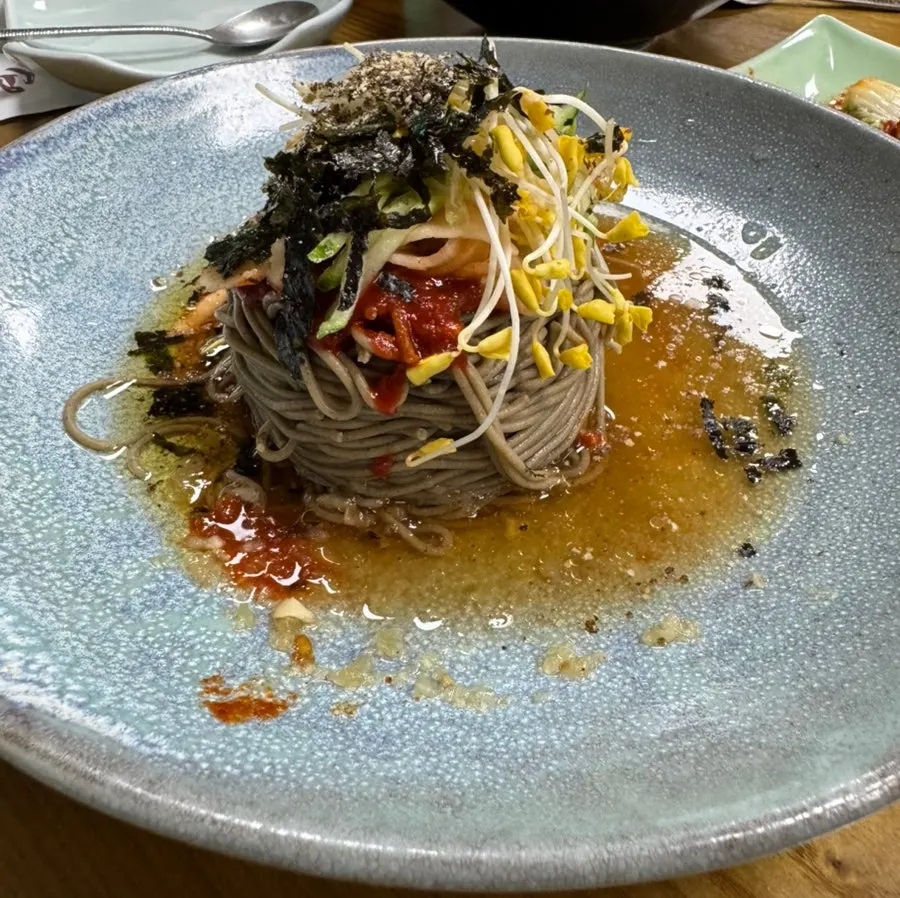 A bowl of idaepal 100% buckwheat bibim noodles